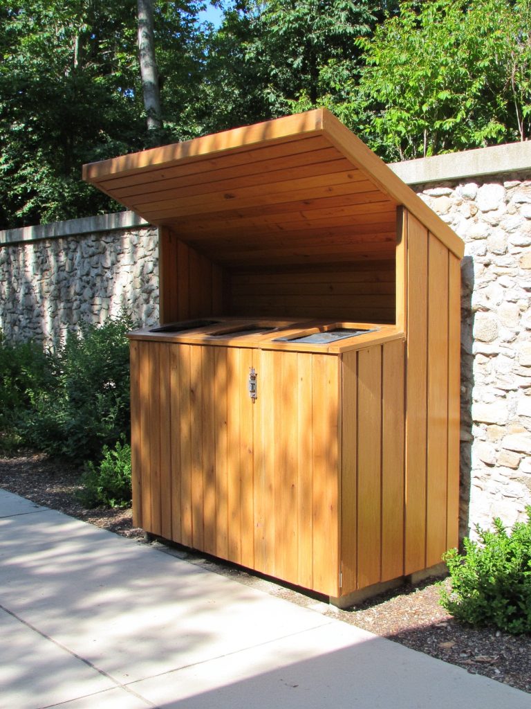 covered garbage can station