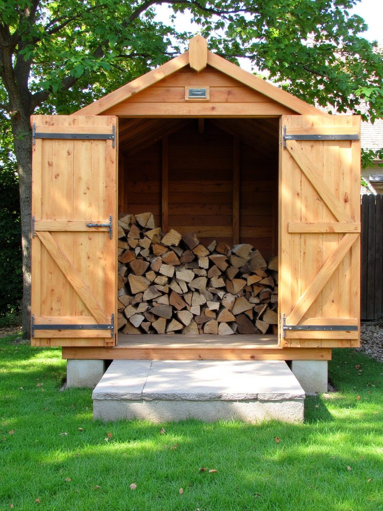 enclosed wooden firewood shed