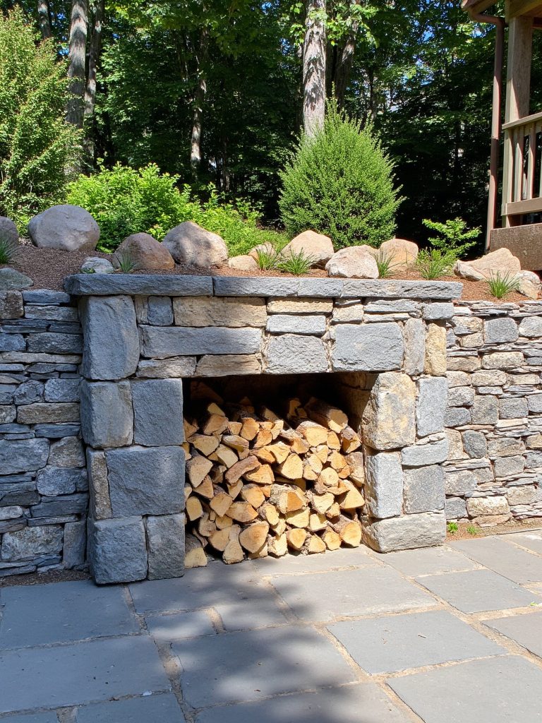 rustic stone wall firewood storage